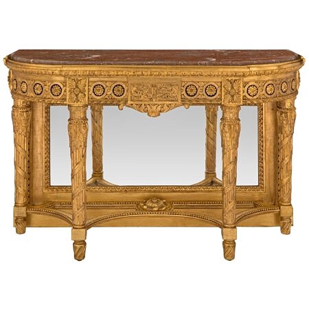 A French 19th century Louis XVI st. Belle Époque period giltwood and marble mirrored console