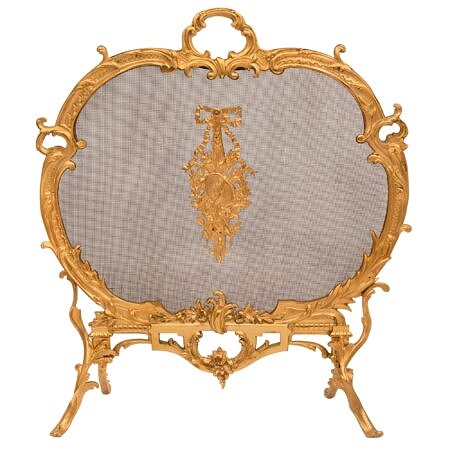 A French 19th century Louis XV st. ormolu and mesh fire screen