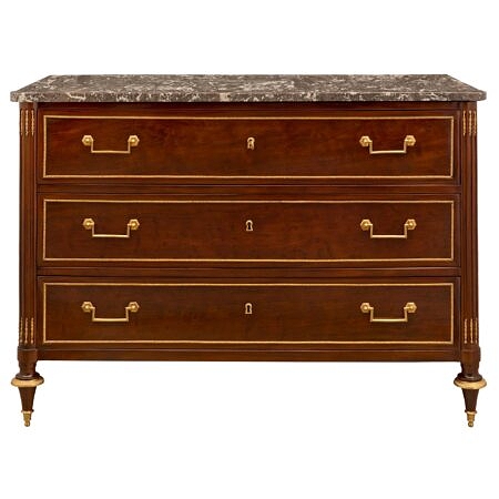 A French 19th century Louis XVI st. Moucheté Mahogany, ormolu and Gris St. Anne marble commode