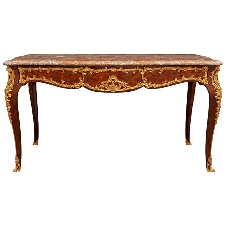 A French 19th century Louis XV st. Tulipwood, Rosewood, ormolu and Rouge Royale marble center table/desk by Theodore Millet