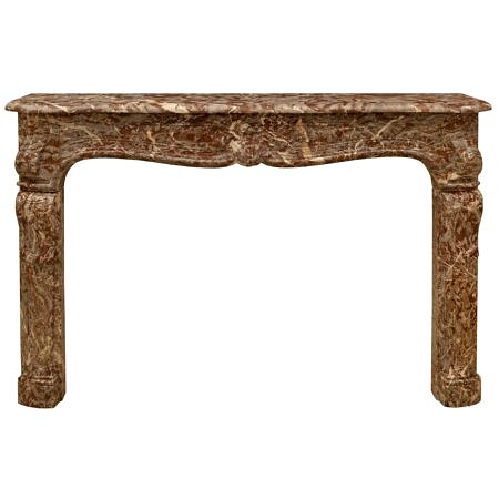 A French 18th century Louis XV Period Rouge Royal marble fireplace mantel