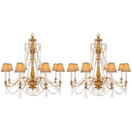 A pair of Italian 19th century Genovese st. giltwood and crystal chandeliers