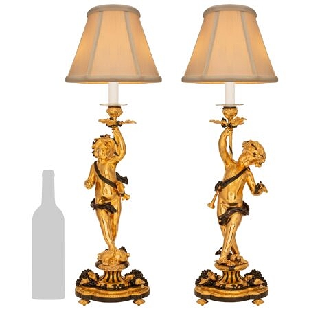 A true pair of French 19th century Louis XVI st. Belle Époque period ormolu and patinated bronze lamps