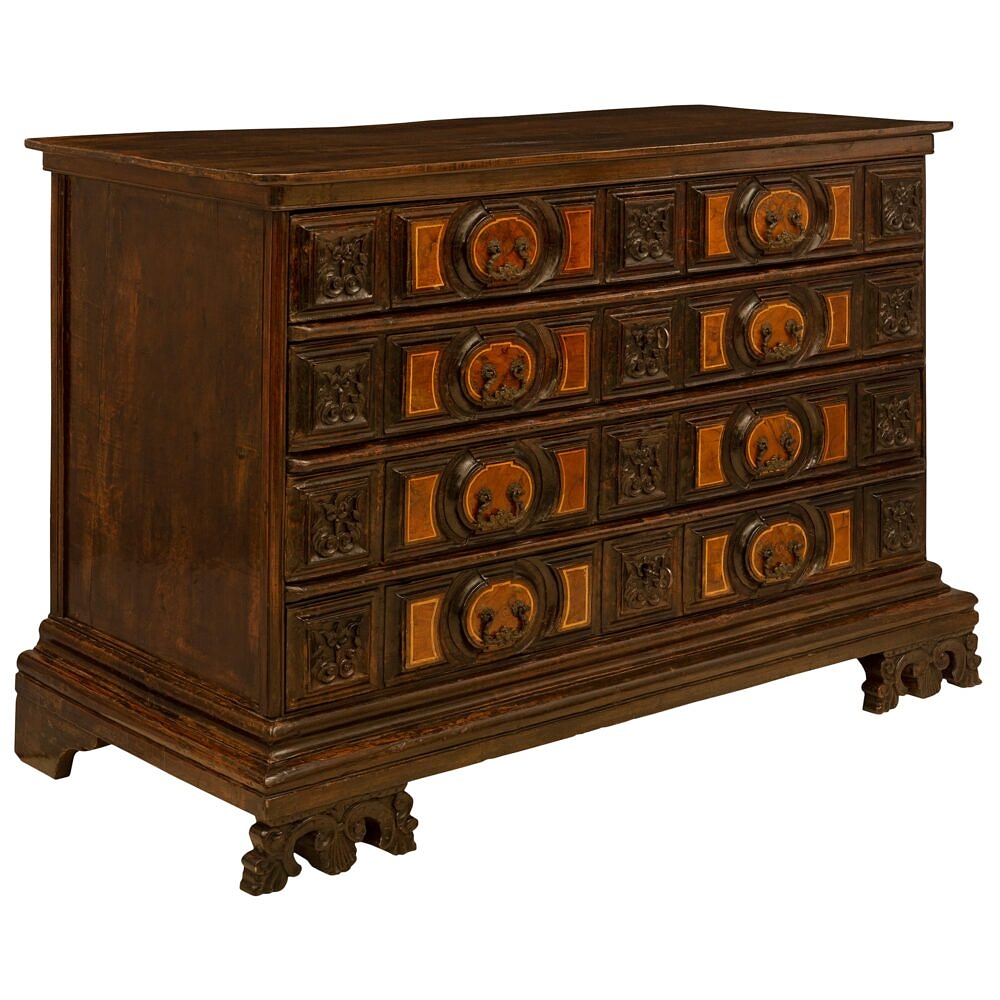 An Italian 18th Century Baroque Period Walnut And Stained Pine Commode