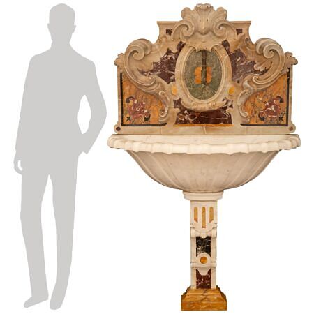 An Italian 19th century Baroque st. specimen marble birdbath/fountain